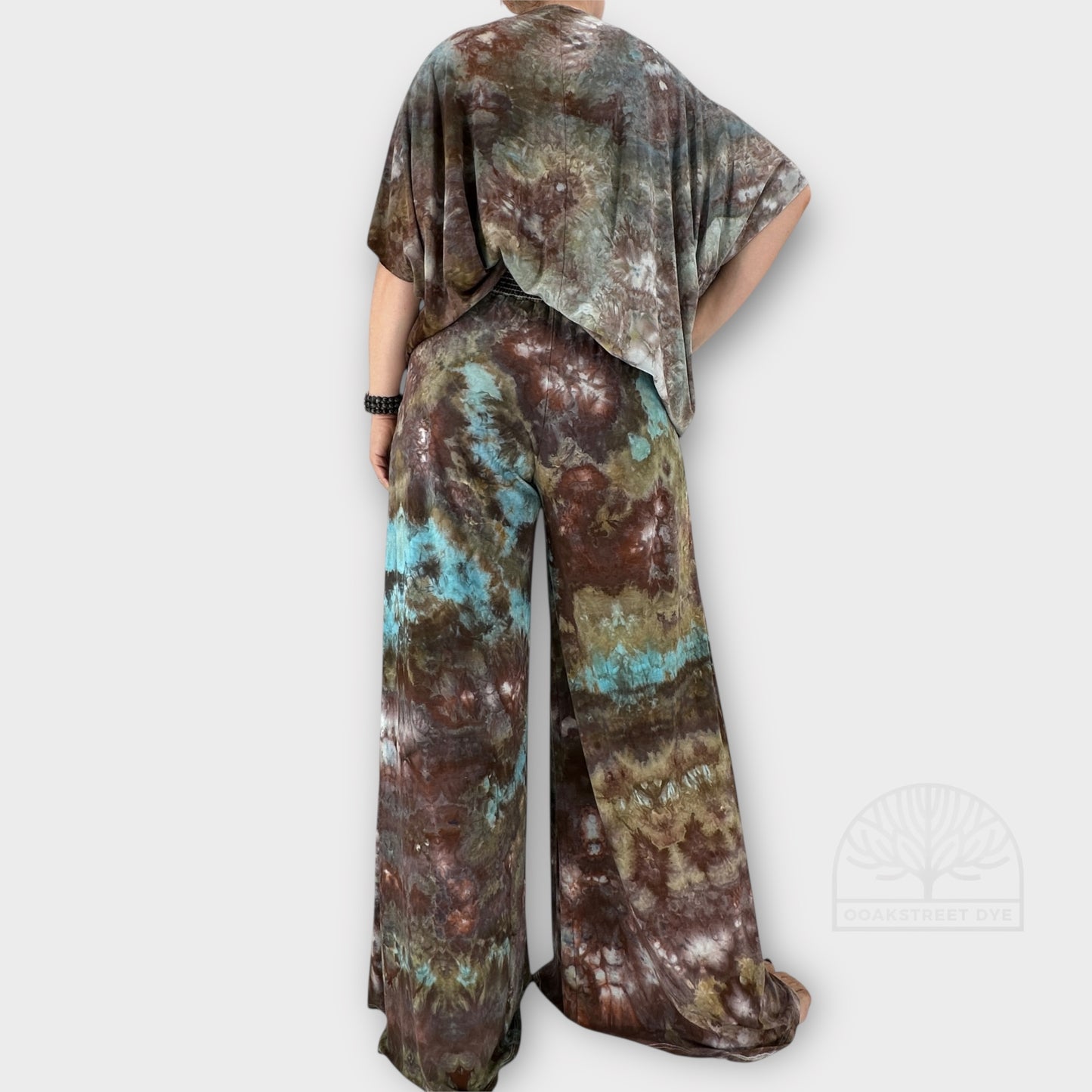 Bronzite tie-dye palazzo pant and twist top set in earthy bronze, charcoal, olive, and subtle blue tones