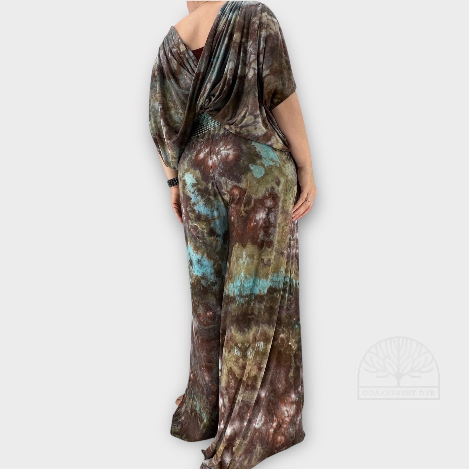 Back detail of Bronzite tie-dye palazzo pant and twist top set in earthy bronze, charcoal, olive, and subtle blue tones