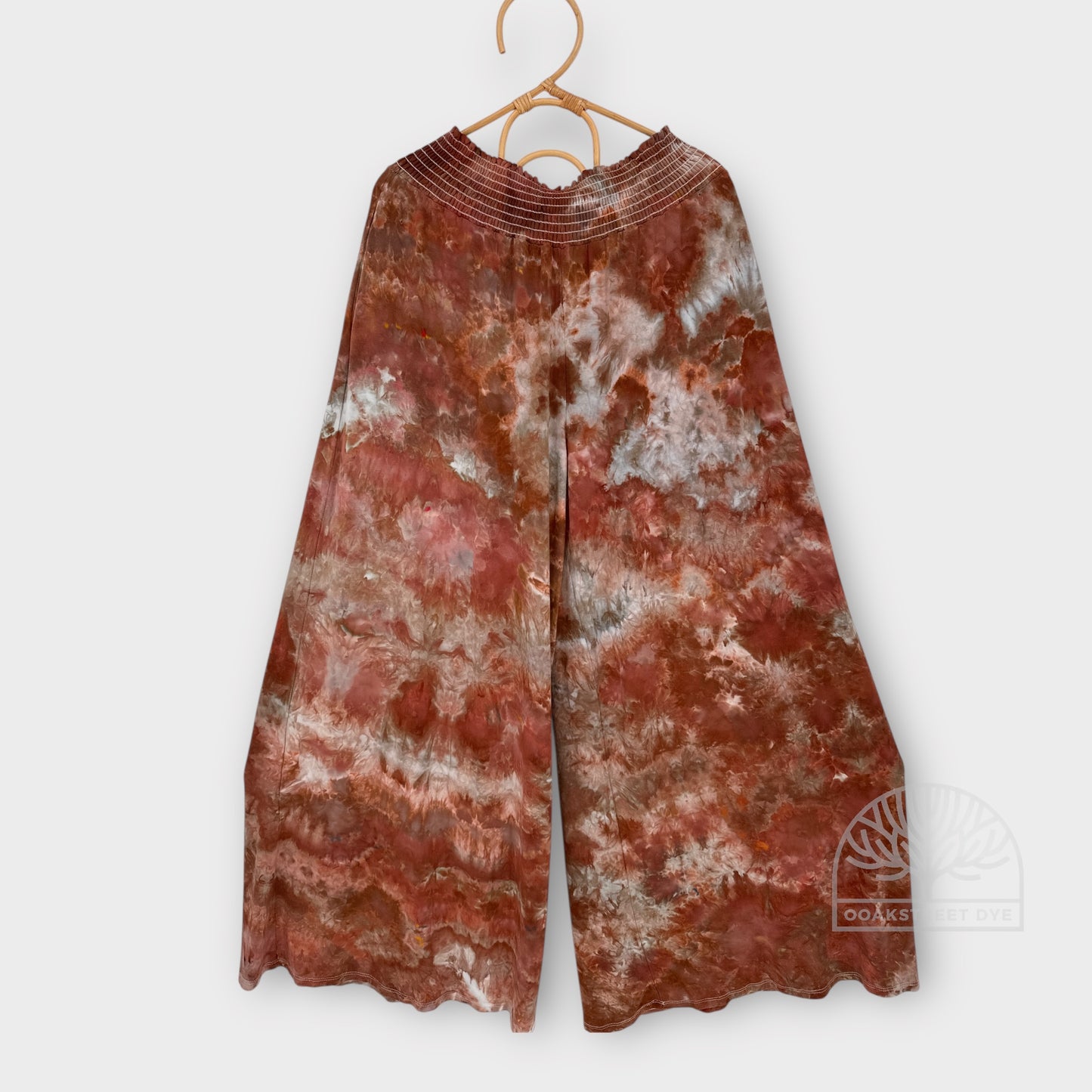 Clay Stone bamboo viscose fabric palazzo pants with organic stone-inspired pattern in warm brown, soft gray, and pale blue