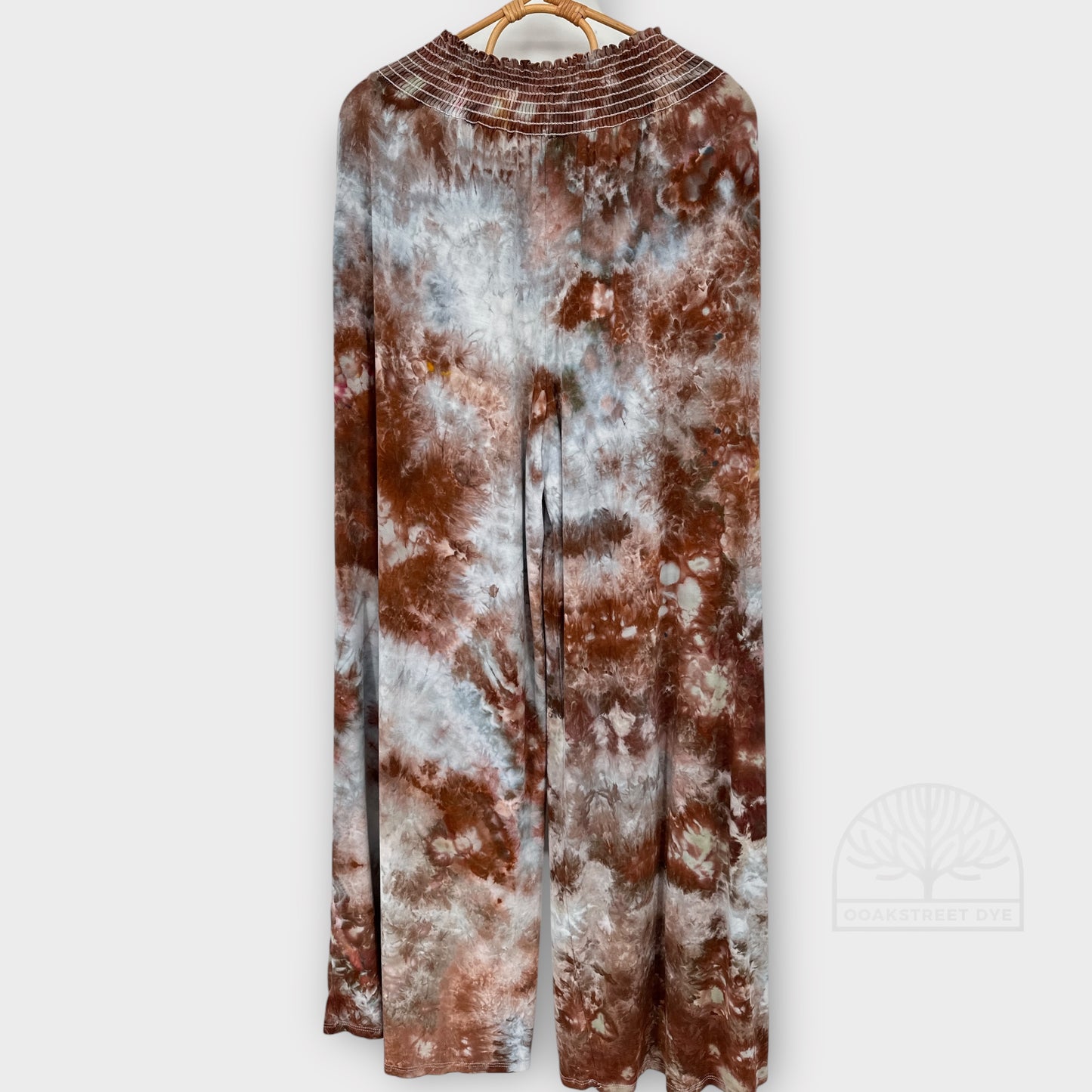 Clay Stone bamboo viscose fabric palazzo pants with organic stone-inspired pattern in warm brown, soft gray, and pale blue