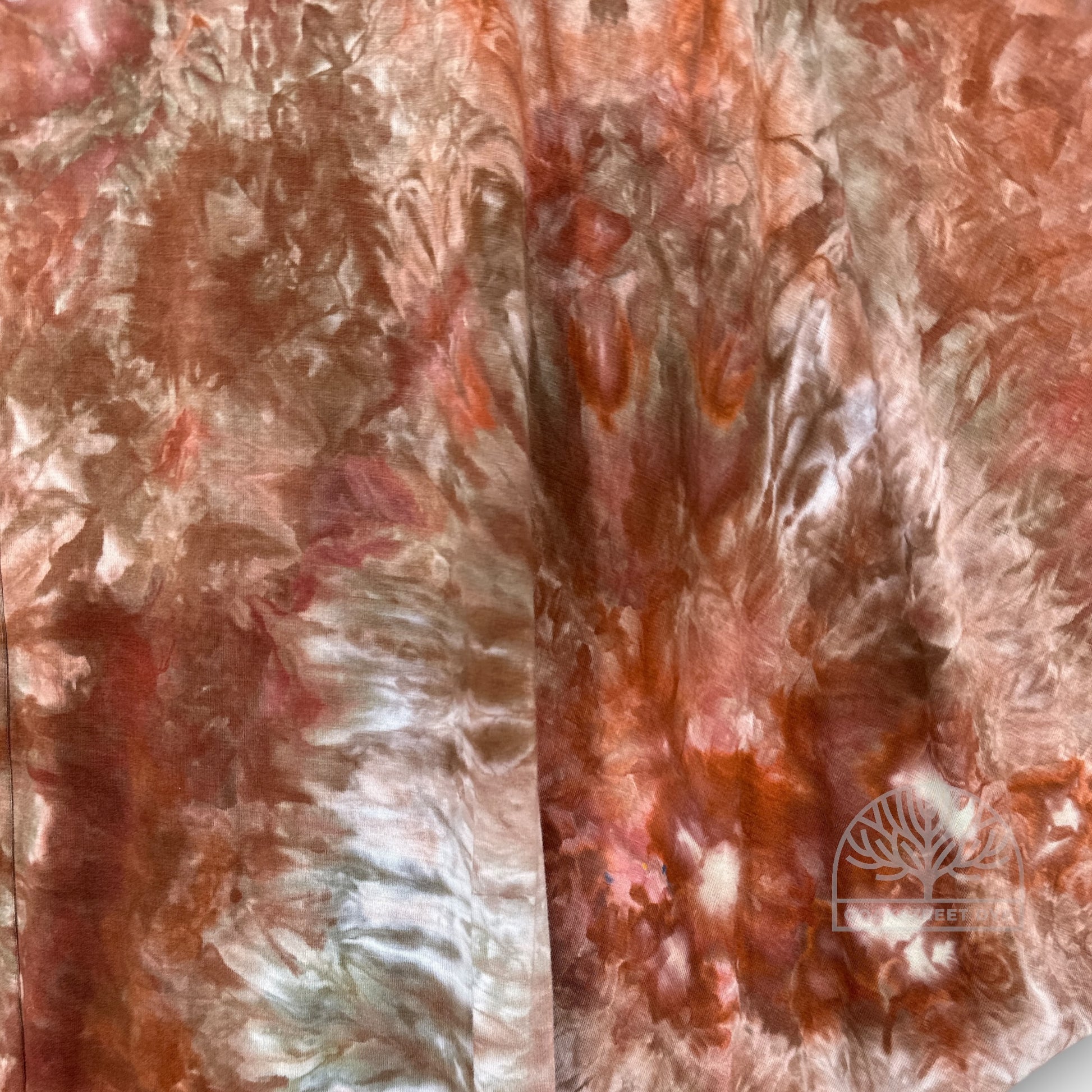 Close up of Clay Stone bamboo viscose fabric with organic stone-inspired pattern in warm brown, soft gray, and pale blue